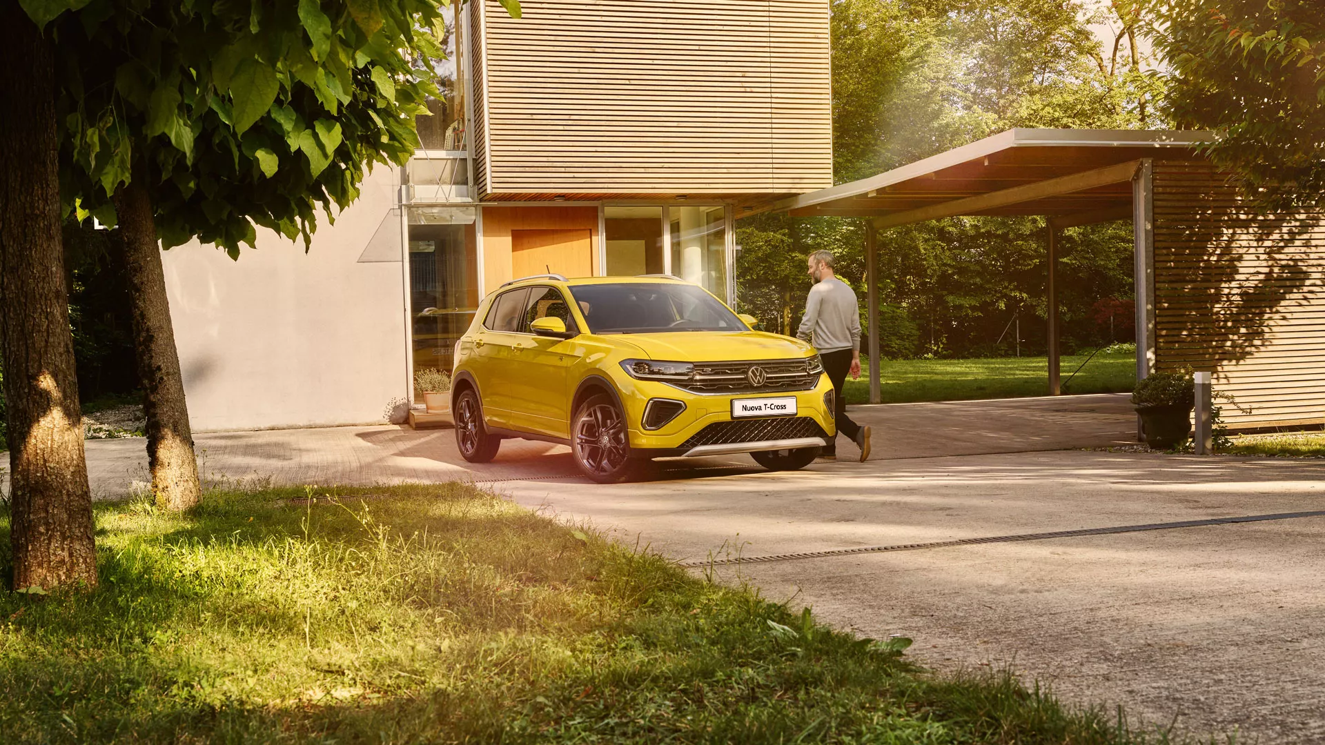 ITA_TS0614_t-cross_exterior-yellow-t-cross-parked-infront-of-house